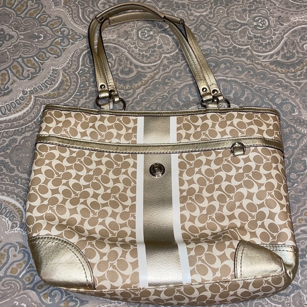 Gold coach purse with lavender inside
